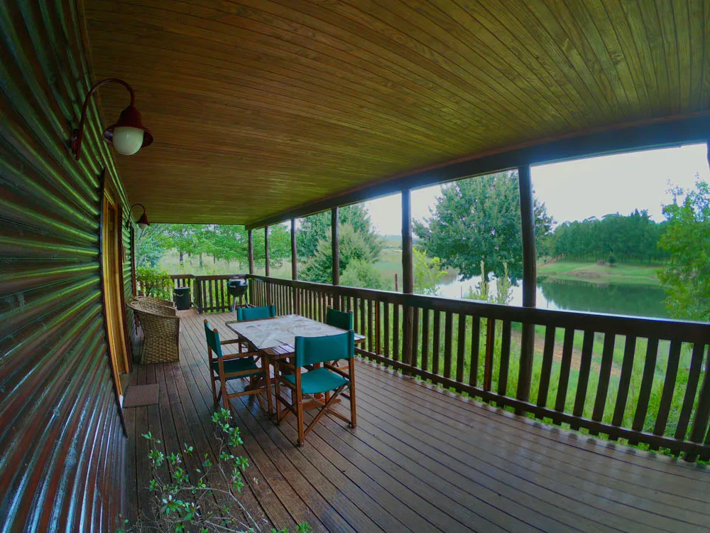 Invicta cabin deck overlooking the dam | Fancy Free - Mpumalanga - Dullstroom
