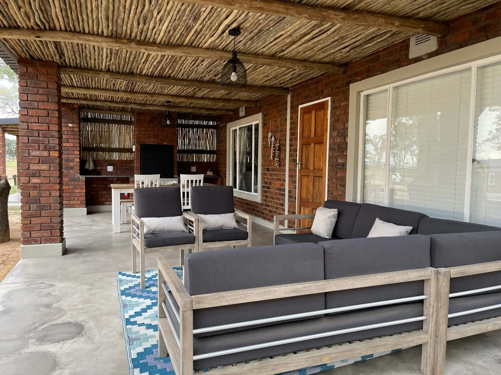 Covered stoep lounge and braai at Sunfish, Groendraai River Cottages | Groendraai River Cottages - Sunfish - Limpopo - Vaalwater