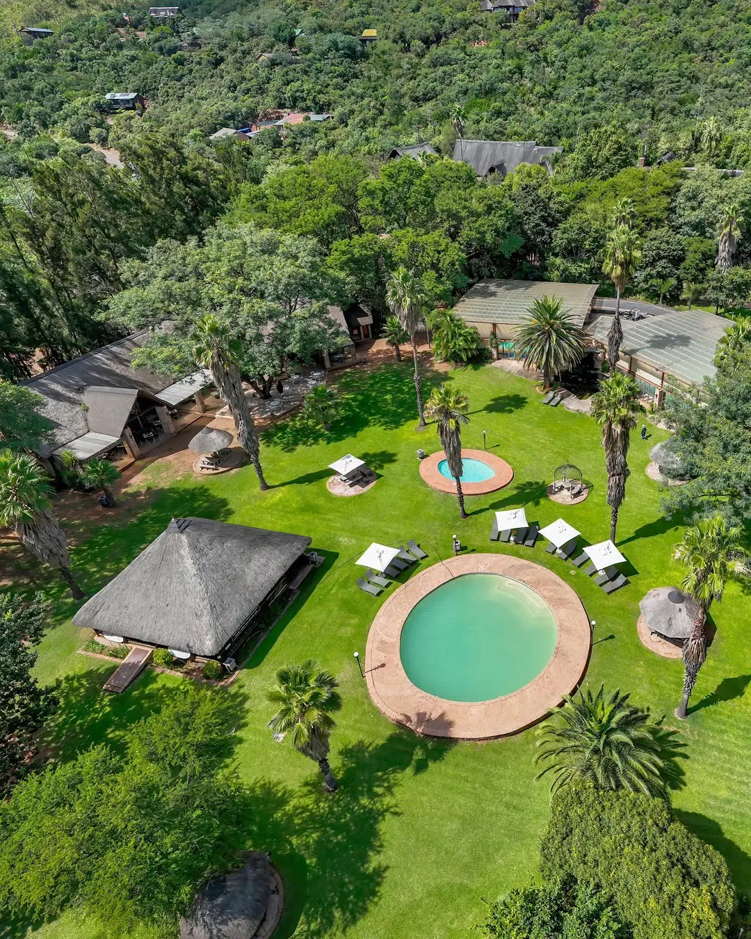 Lodge pools and thatched buildings | Olifants River Lodge - Mpumalanga - Middelburg - Olifants River