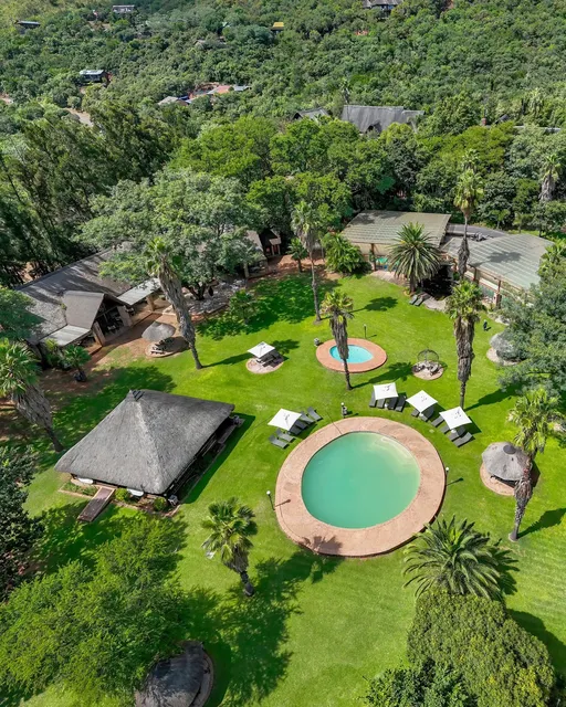 Lodge pools and thatched buildings | Olifants River Lodge - Mpumalanga - Middelburg - Olifants River