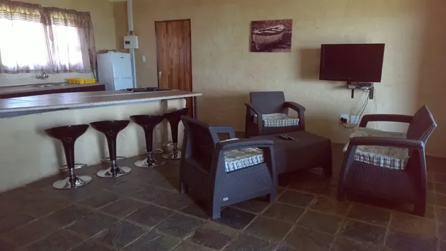 Lounge with bar counter and DStv at Flamink, Dejandri | Dejandri - Flamink - North West - Ventersdorp