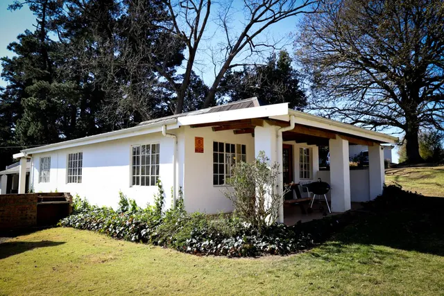 White farm cottage with veranda | Kildare Farm Cottages - KwaZulu-Natal - Nottingham Road