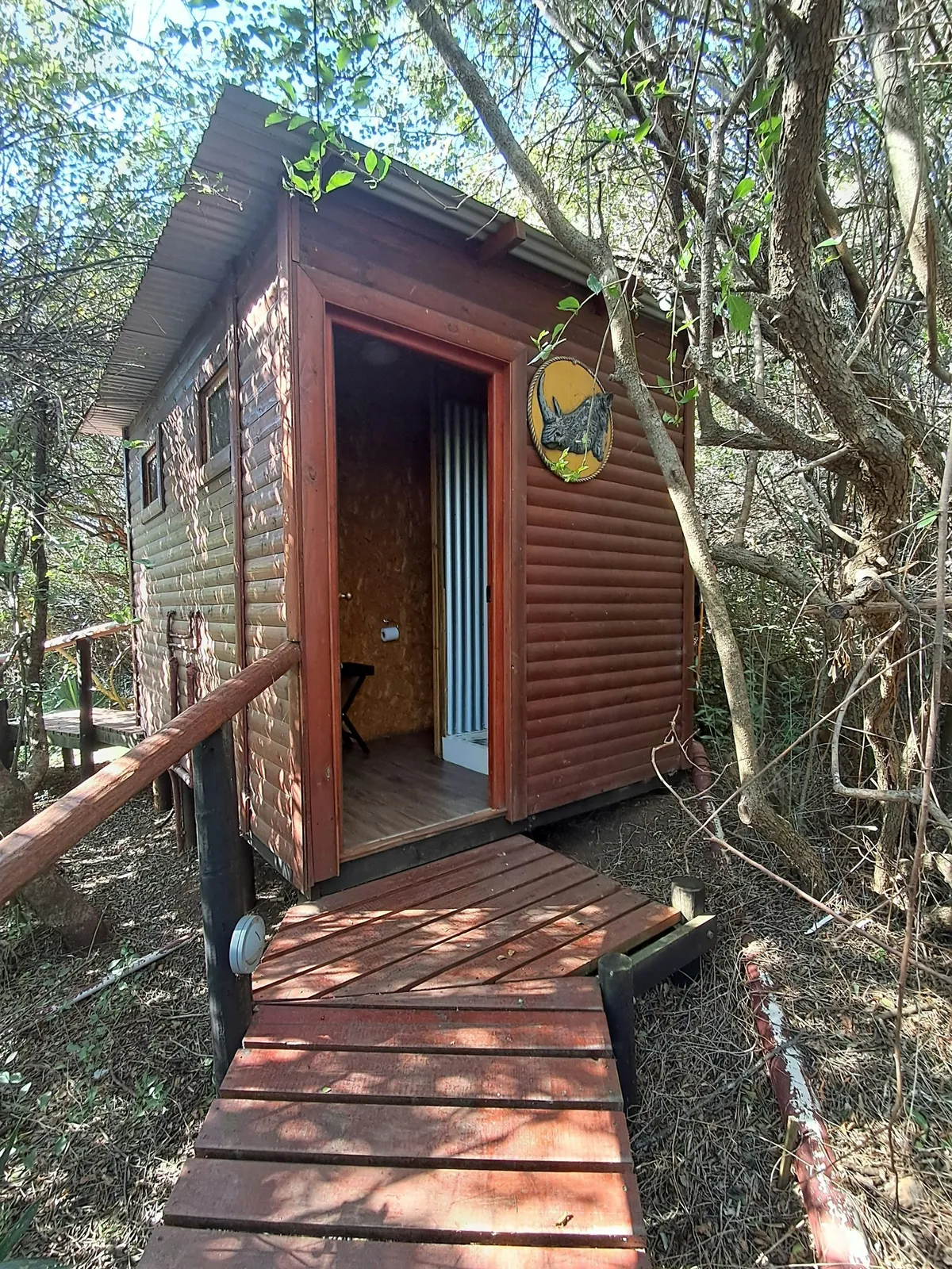 Cabin entrance and boardwalk in trees at Bosbok, FleckVieh | Fleckvieh Guest Farm - Bosbok - Western Cape - Swellendam