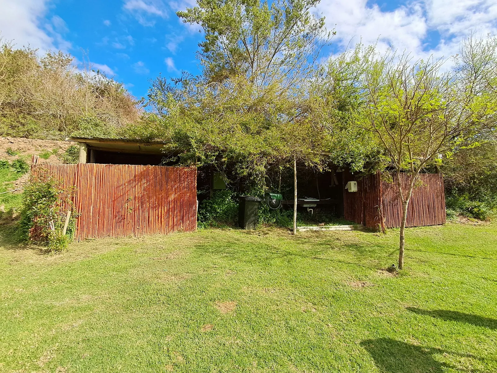 Reed huts under trees at Camp Site Stream, FleckVieh | Fleckvieh Guest Farm - Camp Site Stream - Western Cape - Swellendam