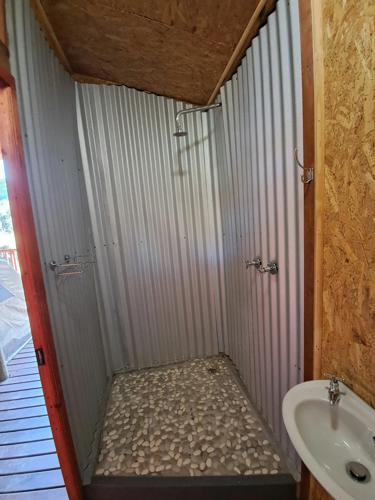Open shower with a pebble floor at Duiker Tent, FleckVieh | Fleckvieh Guest Farm - Duiker Tent - Western Cape - Swellendam