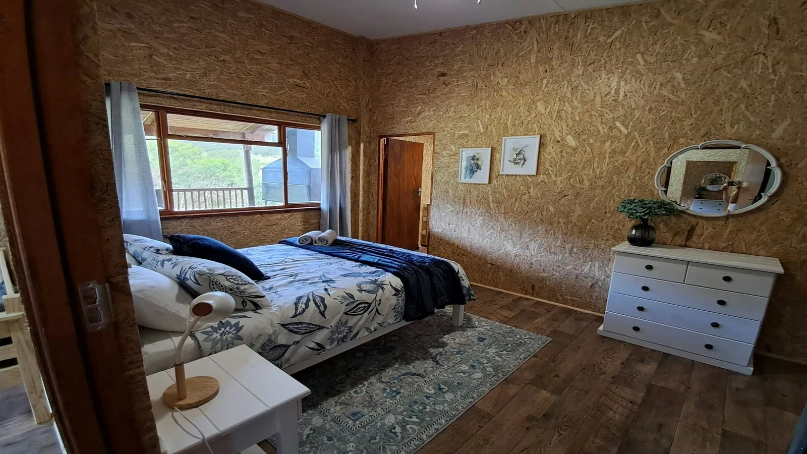 Bedroom with a double bed and white dresser at Kudu, FleckVieh | Fleckvieh Guest Farm - Kudu - Western Cape - Swellendam