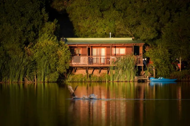 Cabin on the water at dusk at Bloubok, FleckVieh | Fleckvieh Guest Farm - Bloubok - Western Cape - Swellendam