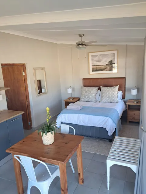Bedroom with a double bed at Chalet 2, FleckVieh | Fleckvieh Guest Farm - Chalet 2 - Western Cape - Swellendam