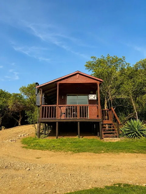 Timber cabin on stilts with a deck at Takbok, FleckVieh | Fleckvieh Guest Farm - Takbok - Western Cape - Swellendam