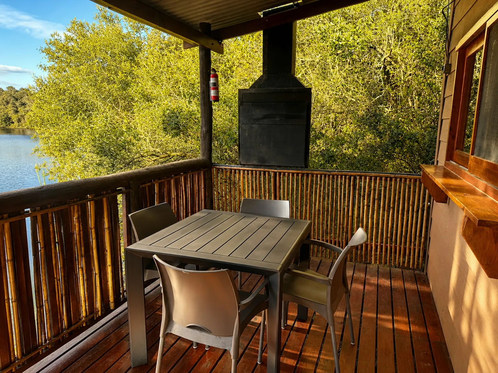 Deck table beside a braai at Bloubok, FleckVieh | Fleckvieh Guest Farm - Bloubok - Western Cape - Swellendam