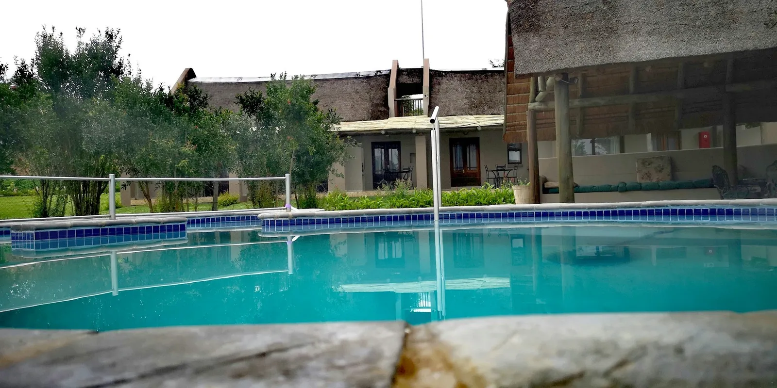 Lodge pool and thatched pavilion | Dunkeld Country & Equestrian Estate - Mpumalanga - Dullstroom