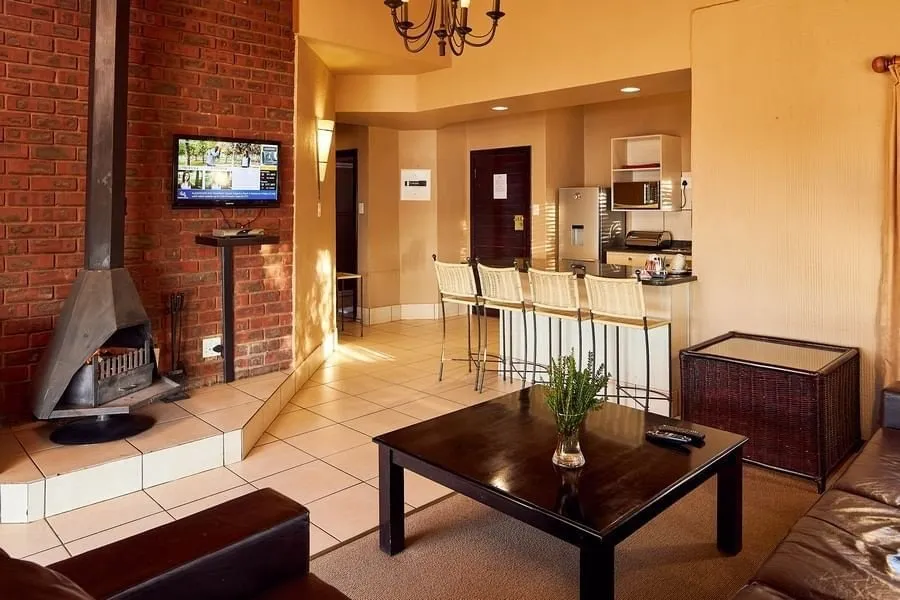 Self-catering chalet lounge and kitchen | Qwantani - Free State - Harrismith - Sterkfontein Dam