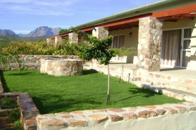 Stone veranda and lawn with mountain views at 7-Sleeper 3-bedroom Cottage 1, Rondegat Guest Farm | Rondegat Guest Farm - 7-Sleeper 3-bedroom Cottage 1 - Western Cape - Clanwilliam - Clanwilliam Dam