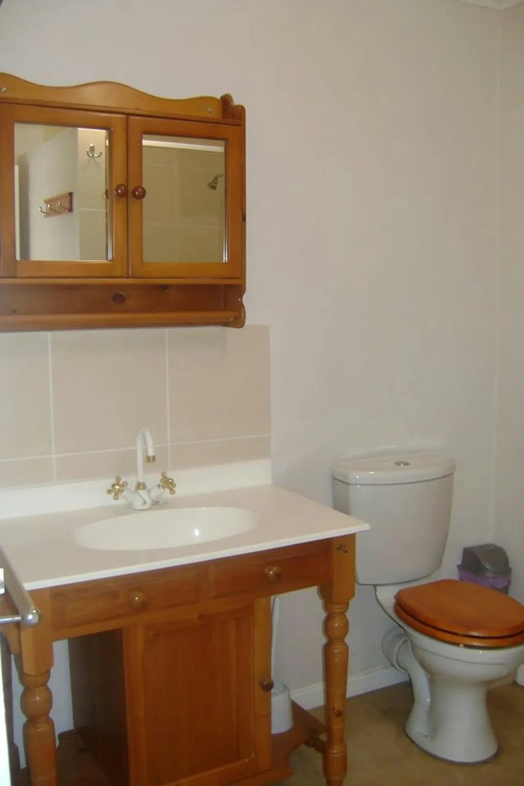 Wooden vanity basin beside a toilet at 7-Sleeper 3-bedroom Cottage 1, Rondegat Guest Farm | Rondegat Guest Farm - 7-Sleeper 3-bedroom Cottage 1 - Western Cape - Clanwilliam - Clanwilliam Dam