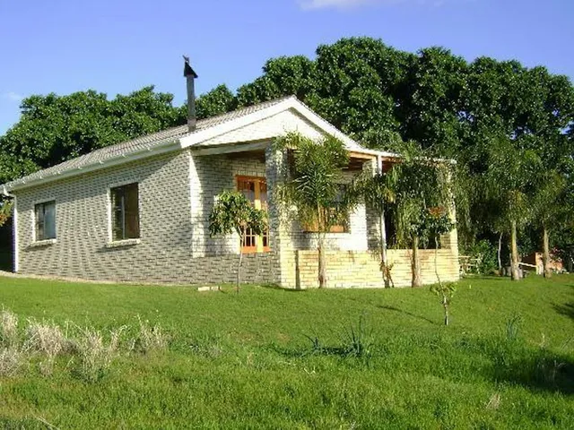 Brick cottage with a chimney on a green lawn at 5-Sleeper 2-bedroom Cottage 2, Rondegat Guest Farm | Rondegat Guest Farm - 5-Sleeper 2-bedroom Cottage 2 - Western Cape - Clanwilliam - Clanwilliam Dam